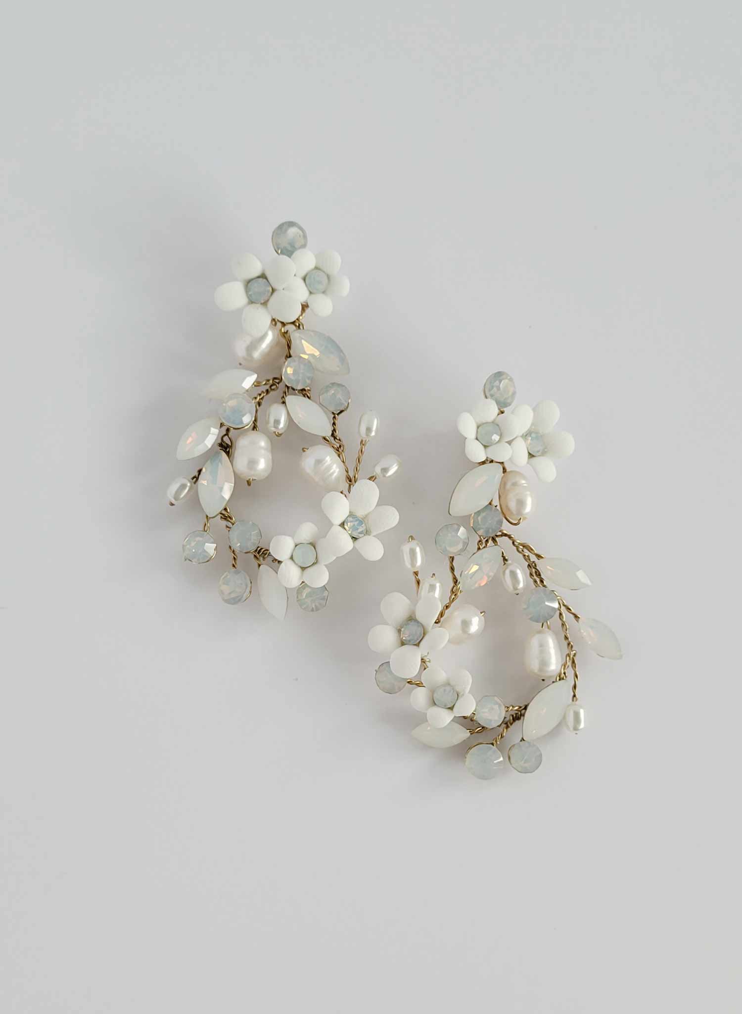 Teardrop shaped bridal and wedding earrings with opal crystals and porcelain flowers. Post backs by Twigs and honey