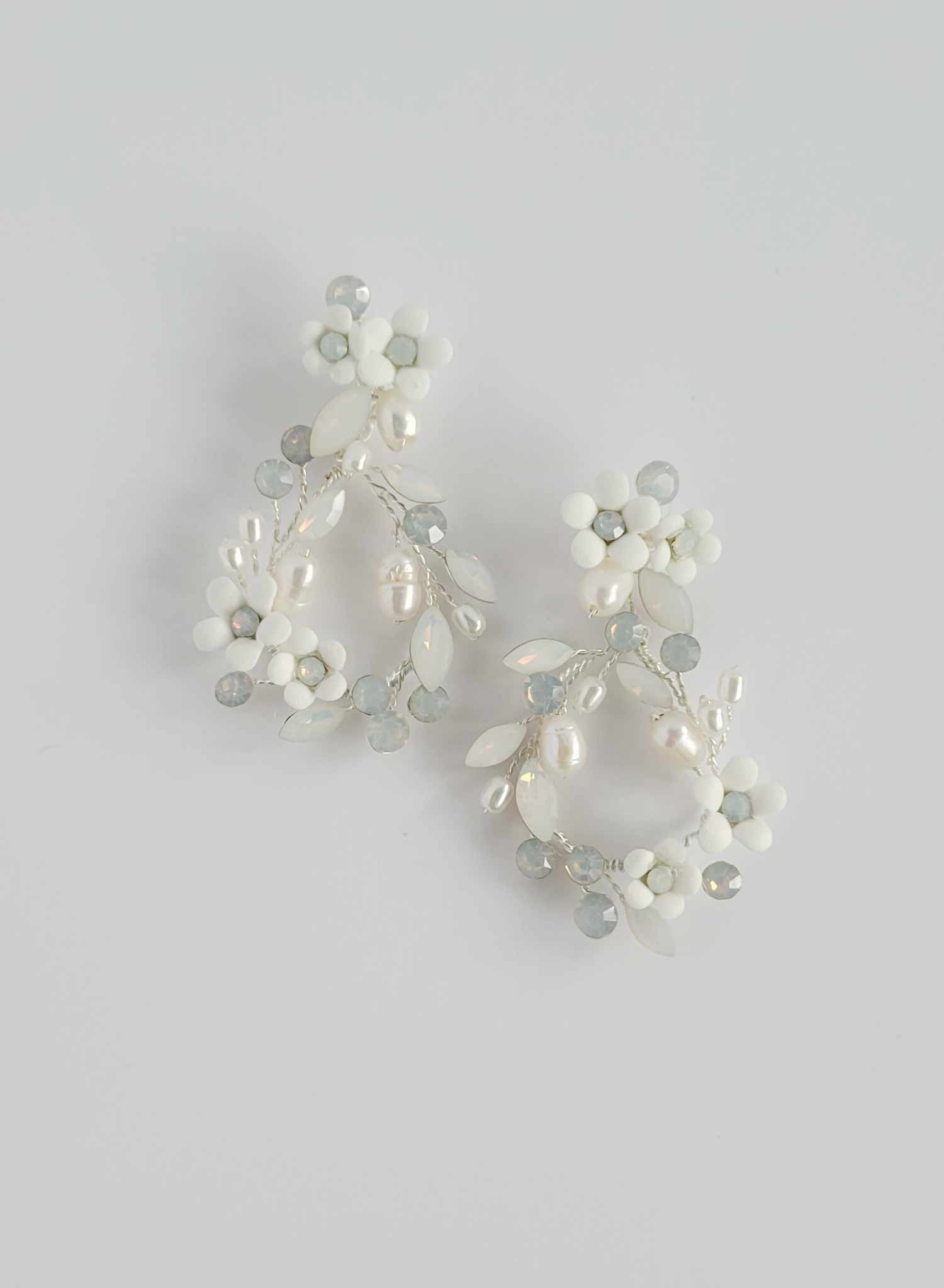 Teardrop shaped bridal and wedding earrings with opal crystals and porcelain flowers. Post backs by Twigs and honey