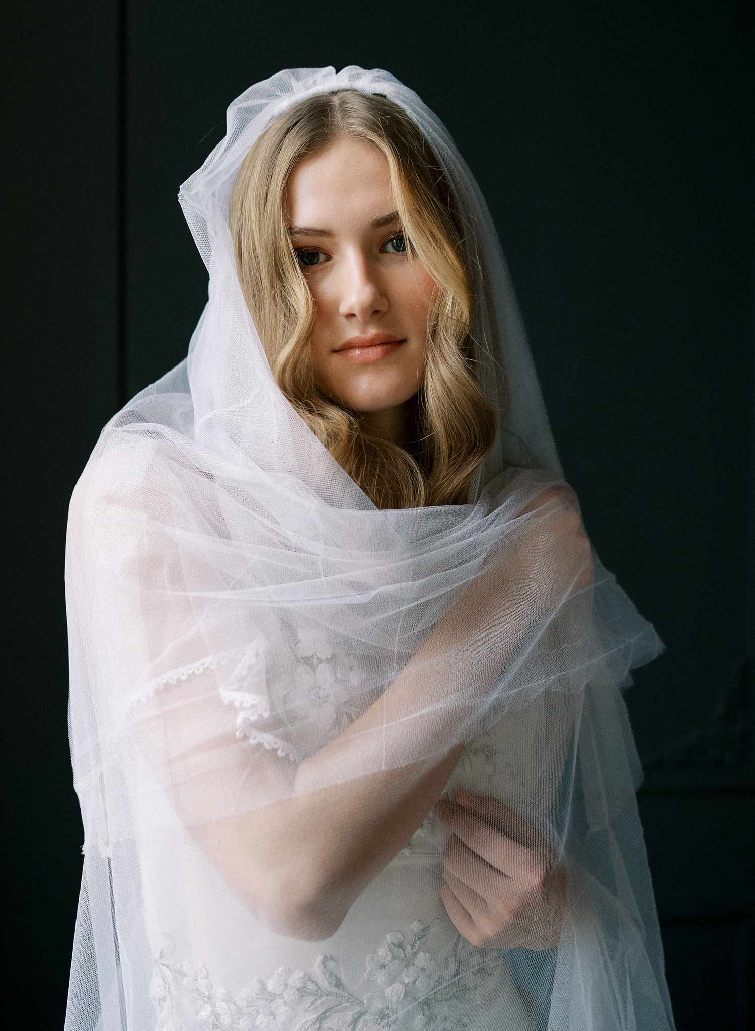 Luxurious wedding veil with blusher and chapel length train made from silk tulle