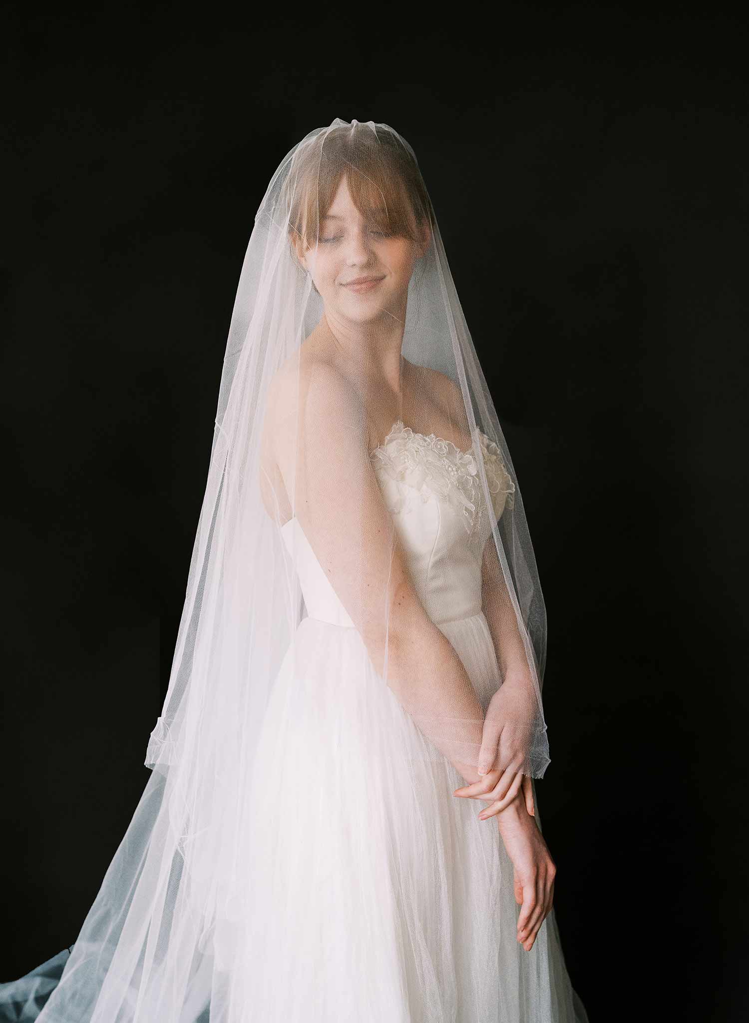 Luxurious wedding veil with blusher and chapel length train made from silk tulle