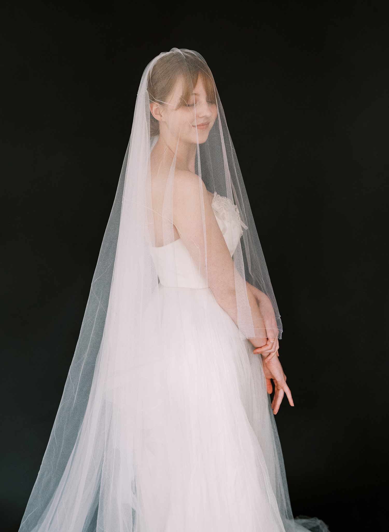 Luxurious wedding veil with blusher and chapel length train made from silk tulle