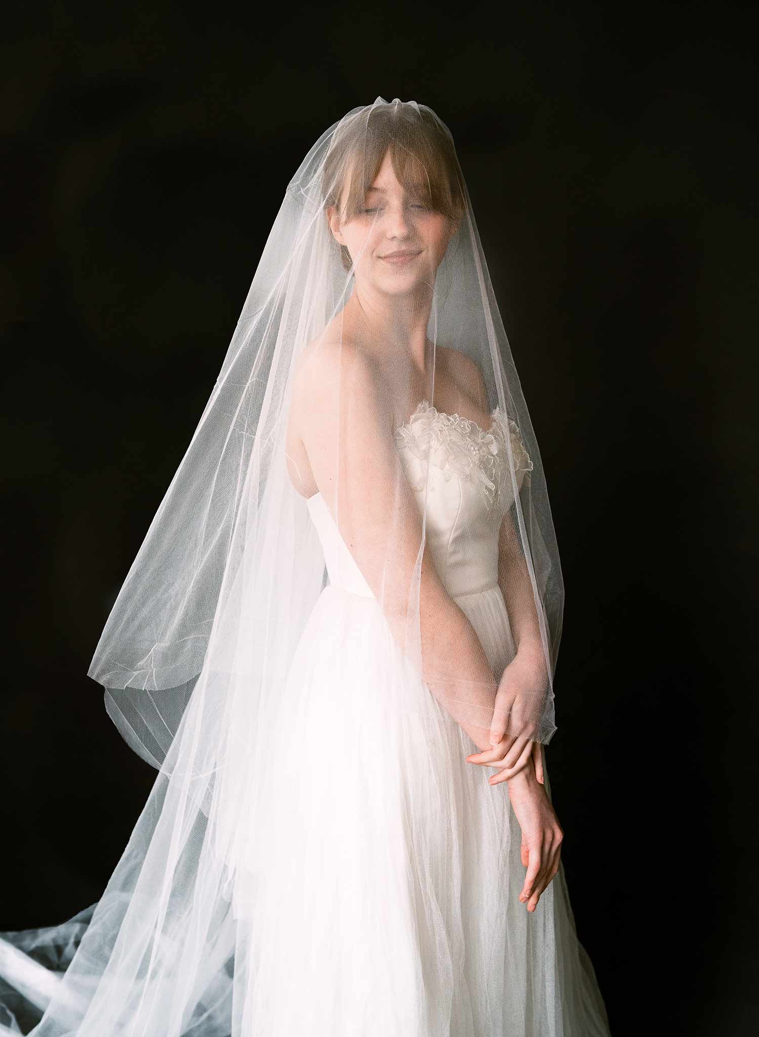 Luxurious wedding veil with blusher and chapel length train made from silk tulle