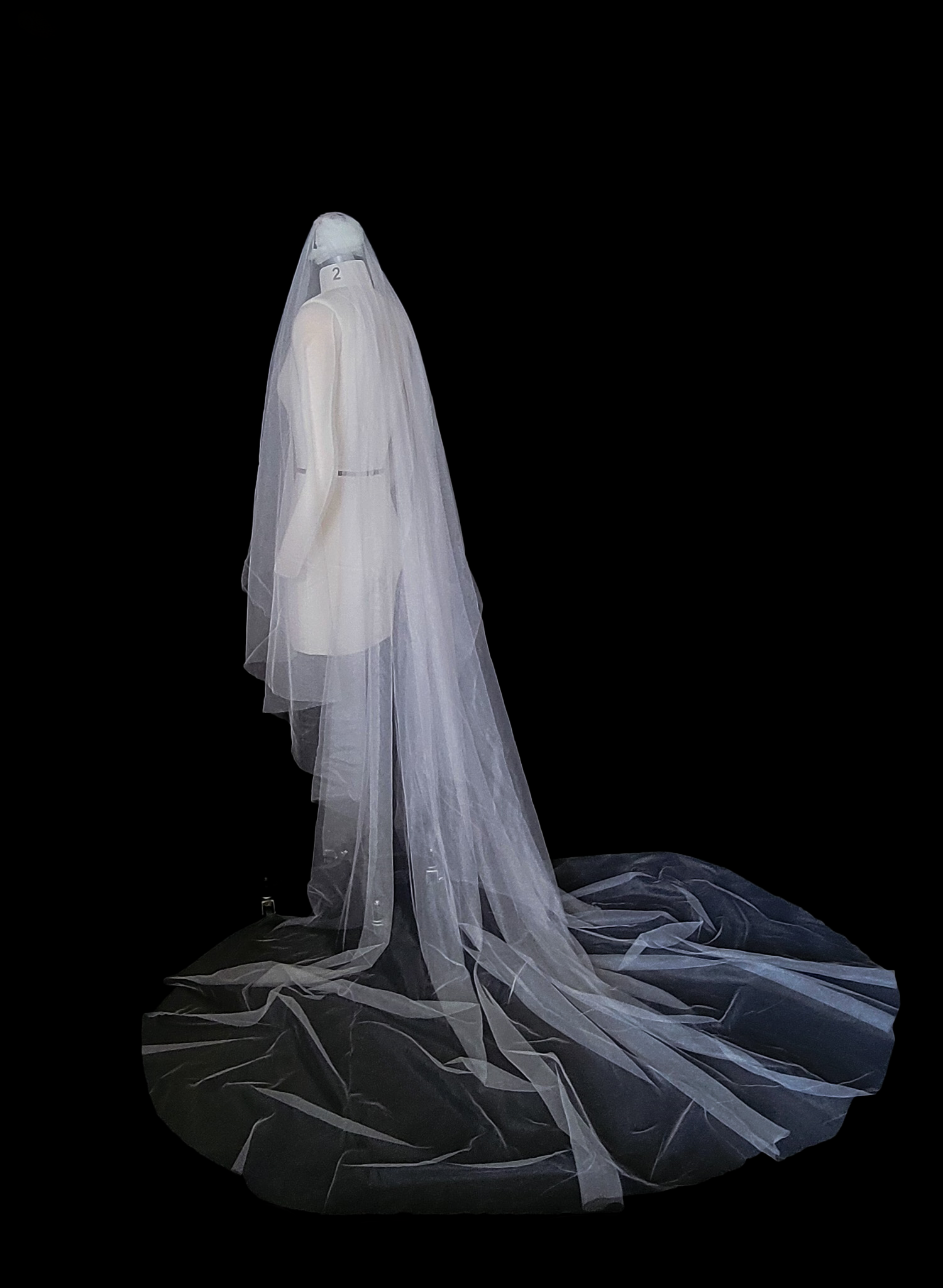 Luxurious wedding veil with blusher and chapel length train made from silk tulle