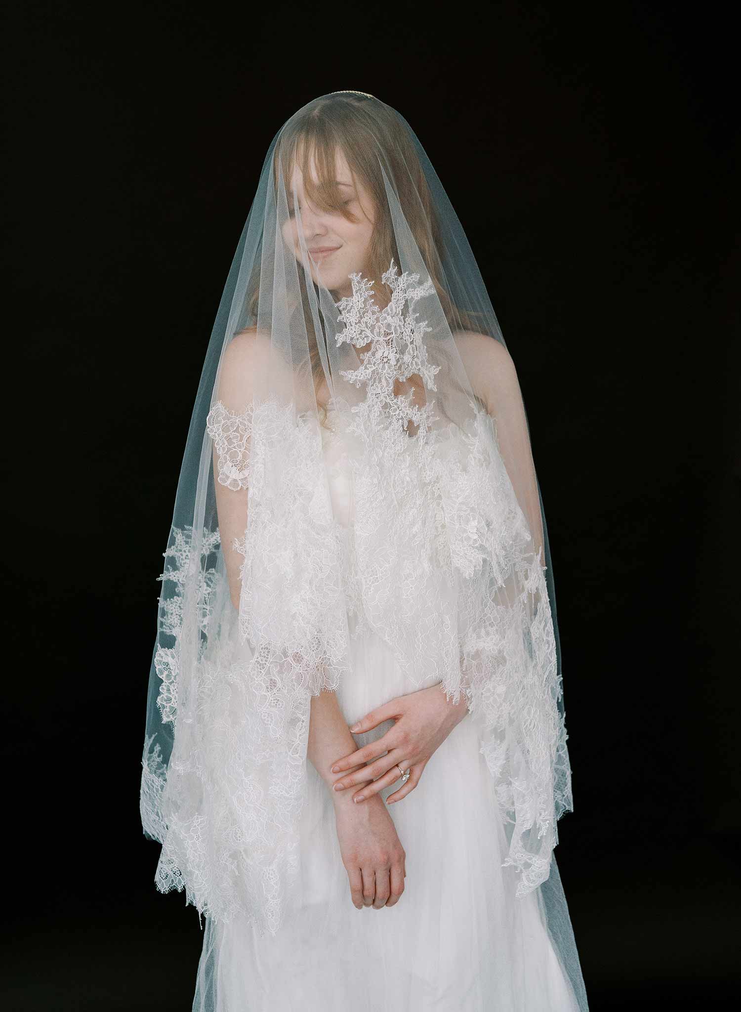 Modern, abstract alencon lace trimmed bridal veil with blusher by Twigs and Honey.