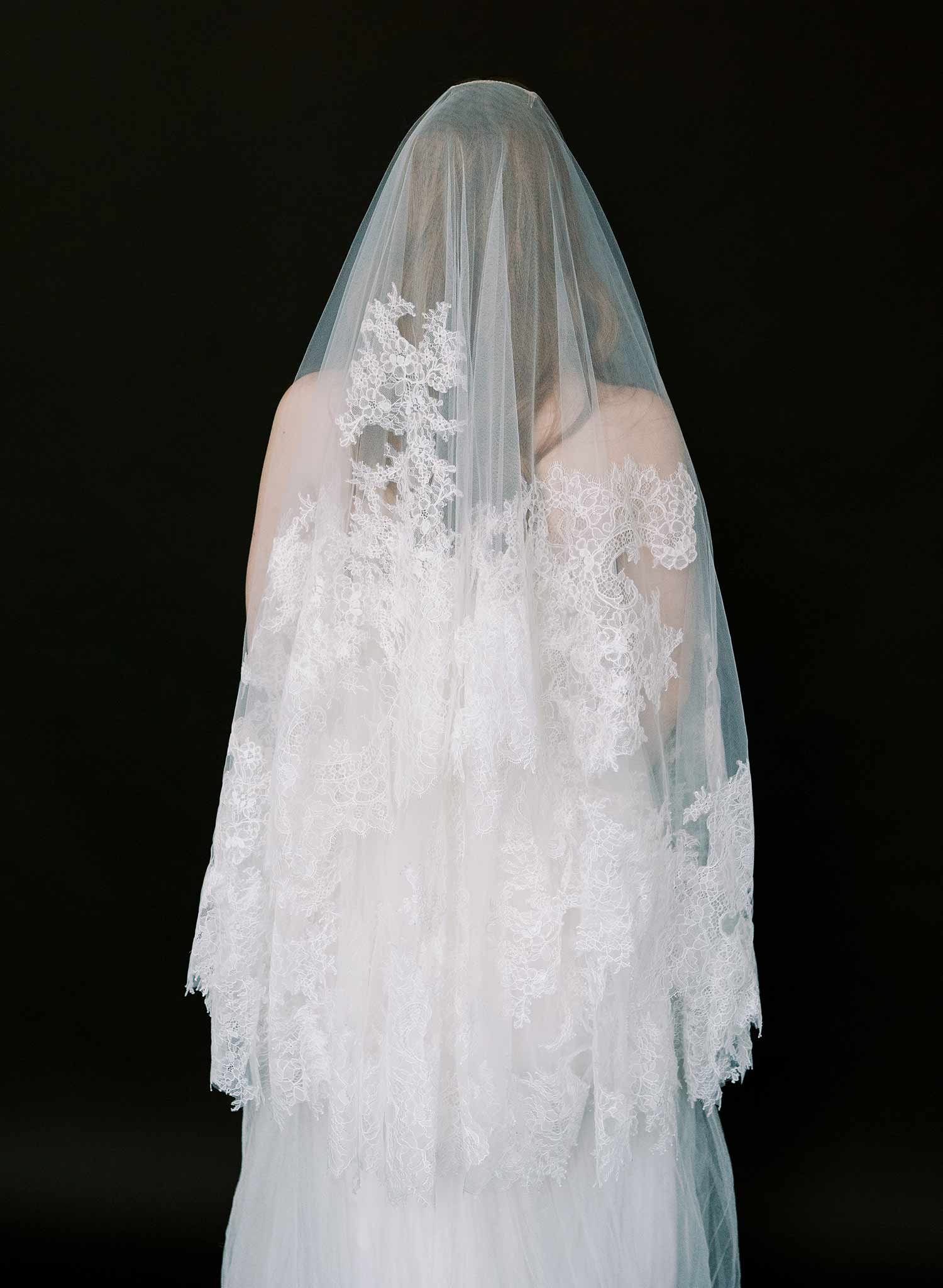 Modern, abstract alencon lace trimmed bridal veil with blusher by Twigs and Honey.