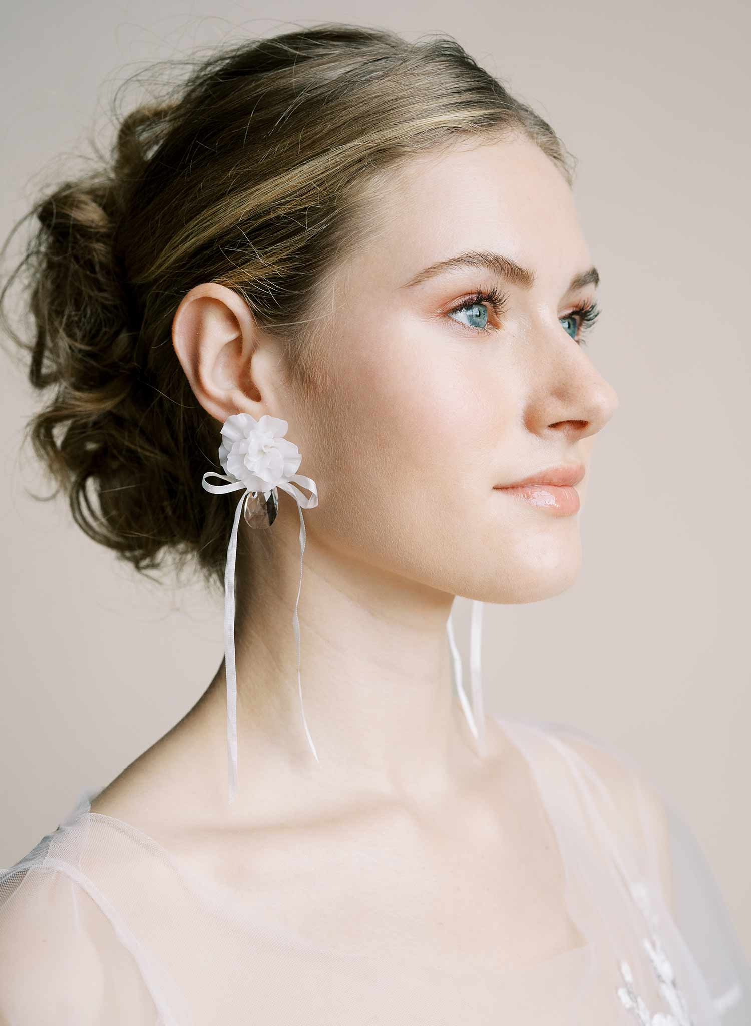 Clean white hand sculpted bridal flower earrings with teardrop clear crystal and silk bows. Wedding earrings by Twigs and Honey