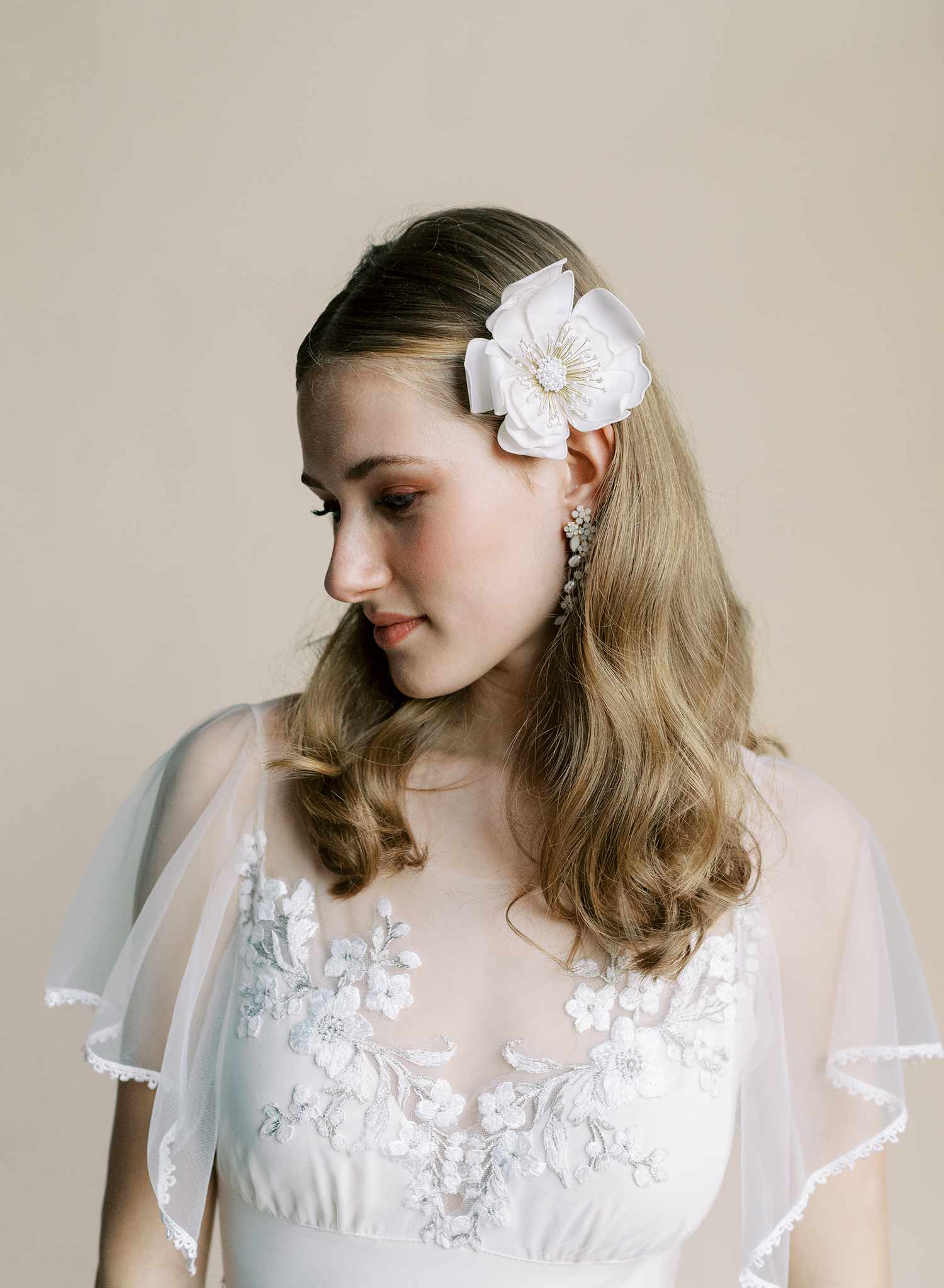 Hand embroidered wedding hair flower on a comb by Twigs and honey