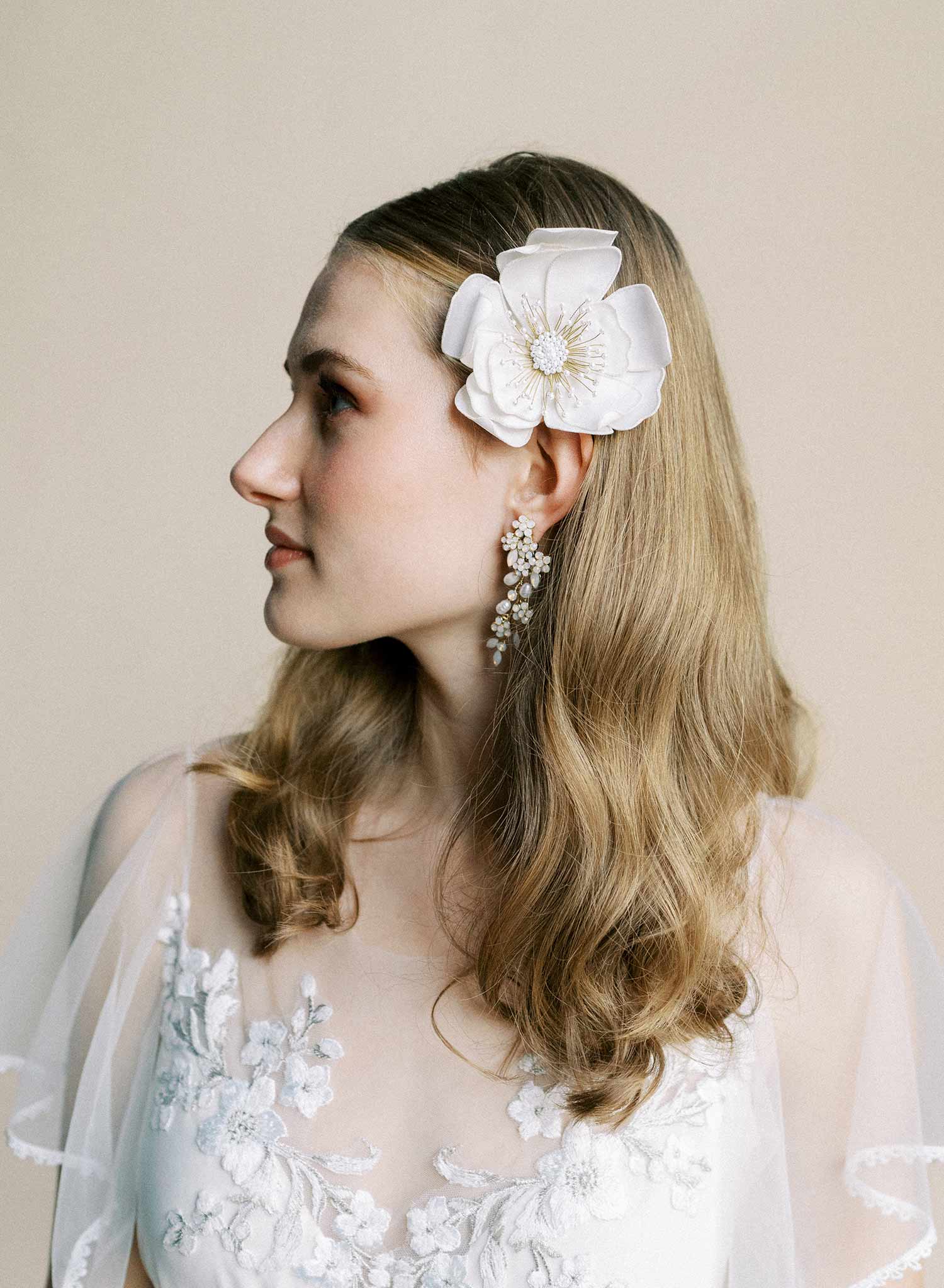 Hand embroidered wedding hair flower on a comb by Twigs and honey