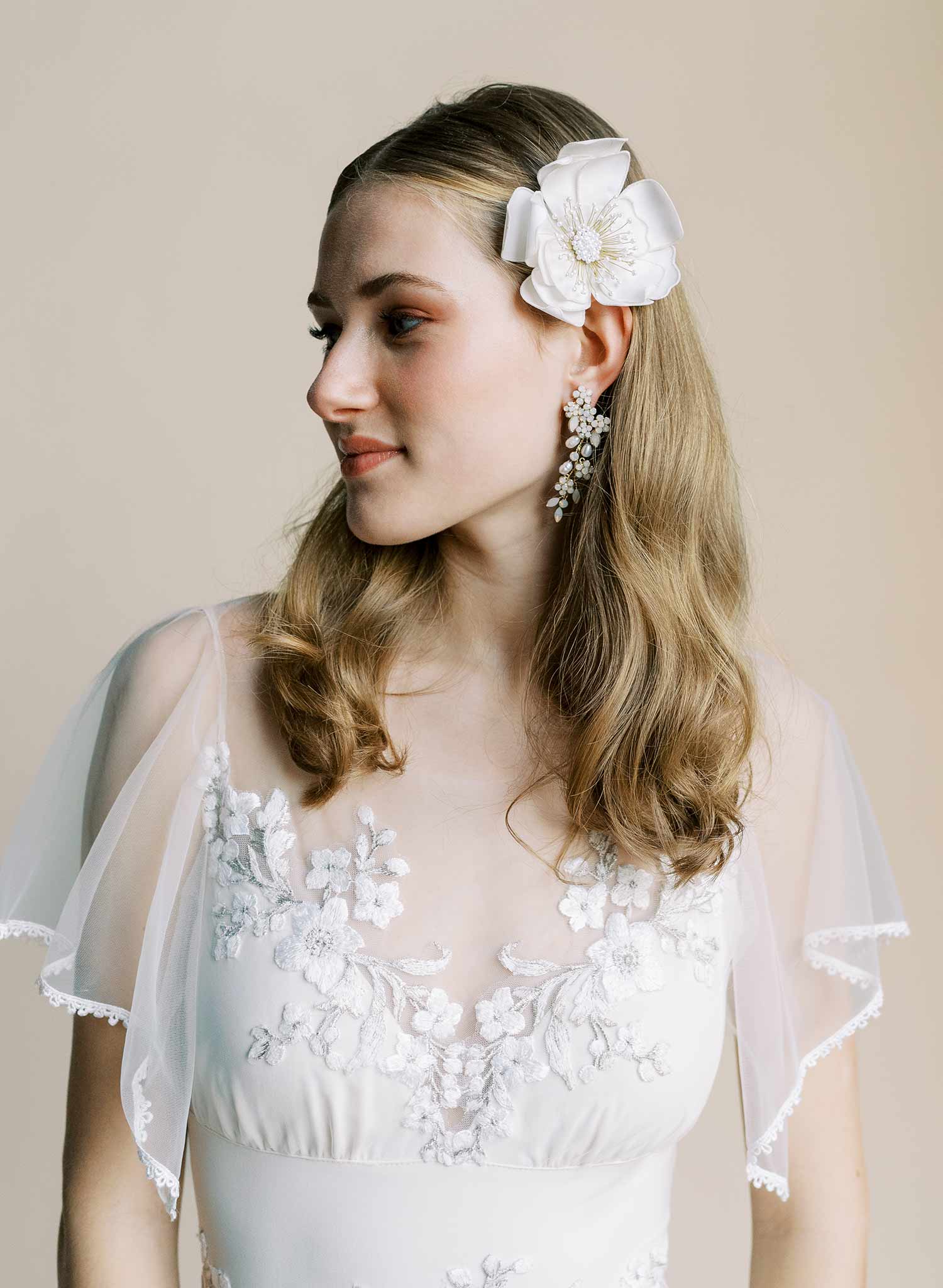 Hand embroidered wedding hair flower on a comb by Twigs and honey