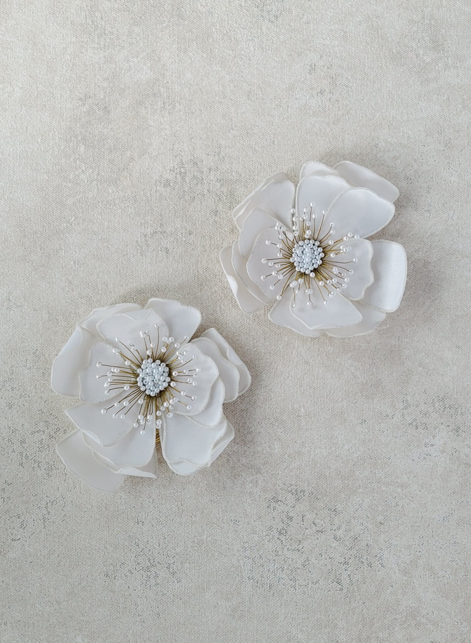 Hand embroidered wedding hair flower on a comb by Twigs and honey