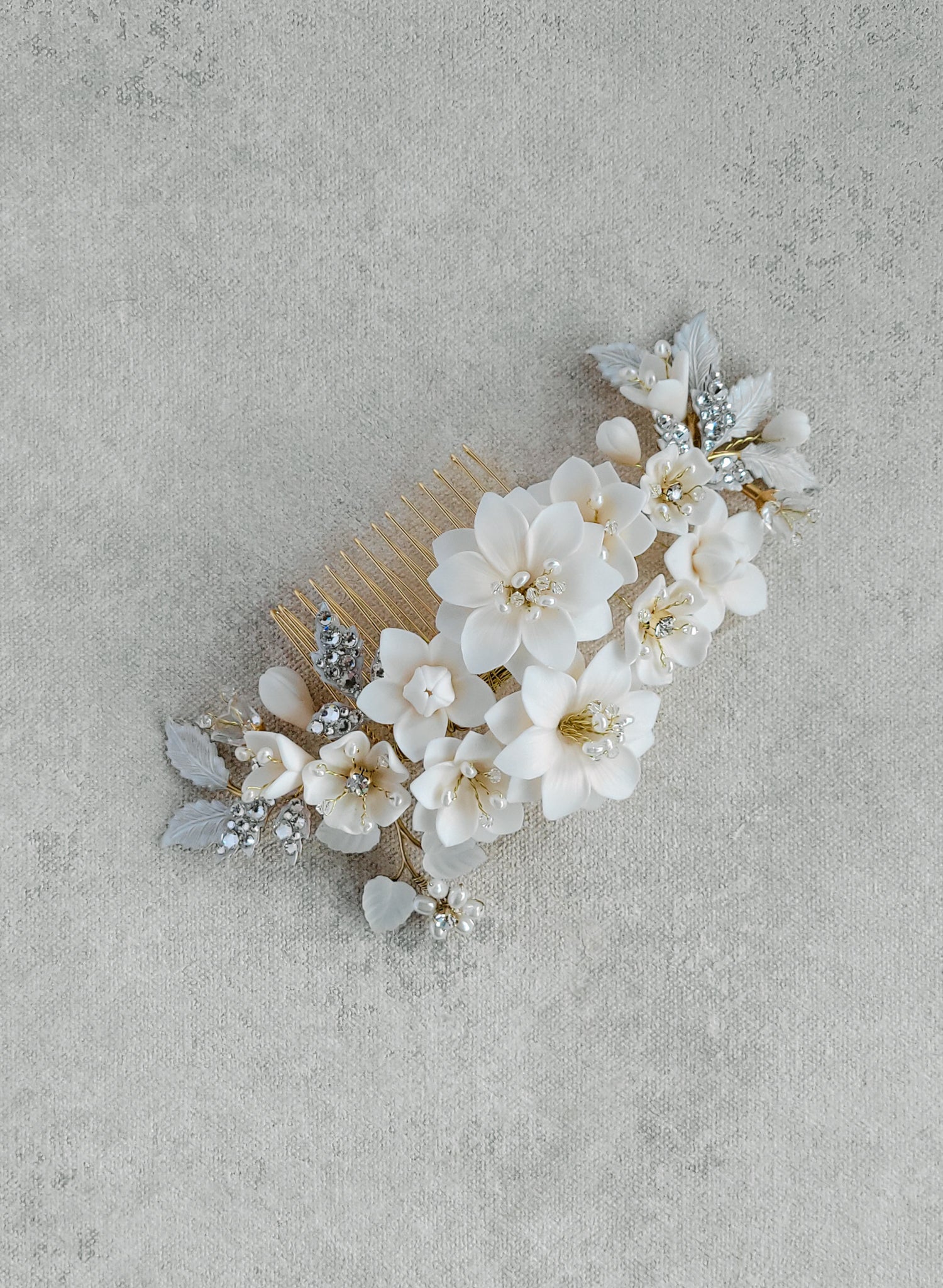 Intricate bridal hair comb with handmade clay flowers, freshwater pearls, Austrian crystals and leaves. By Twigs & Honey