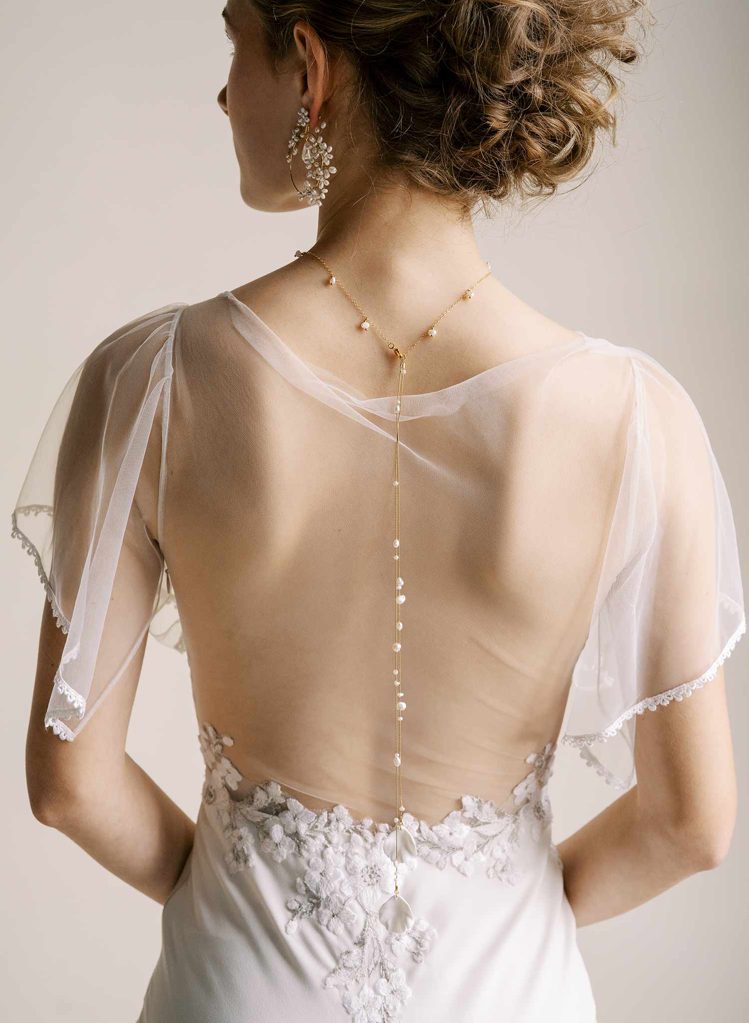 Delicate bridal gold chain necklace with freshwater pearls and floral petals by Twigs & Honey