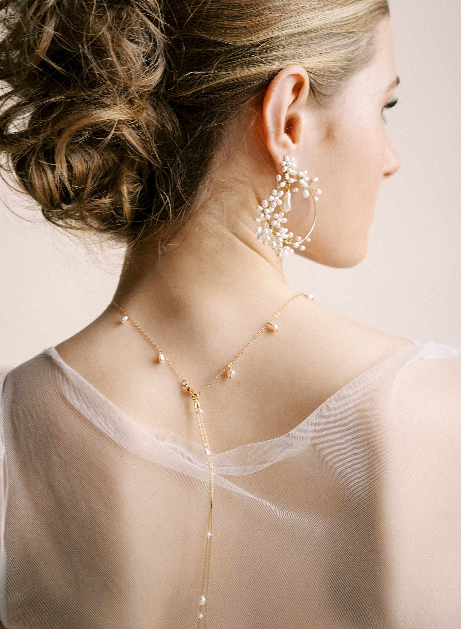 Delicate bridal gold chain necklace with freshwater pearls and floral petals by Twigs & Honey