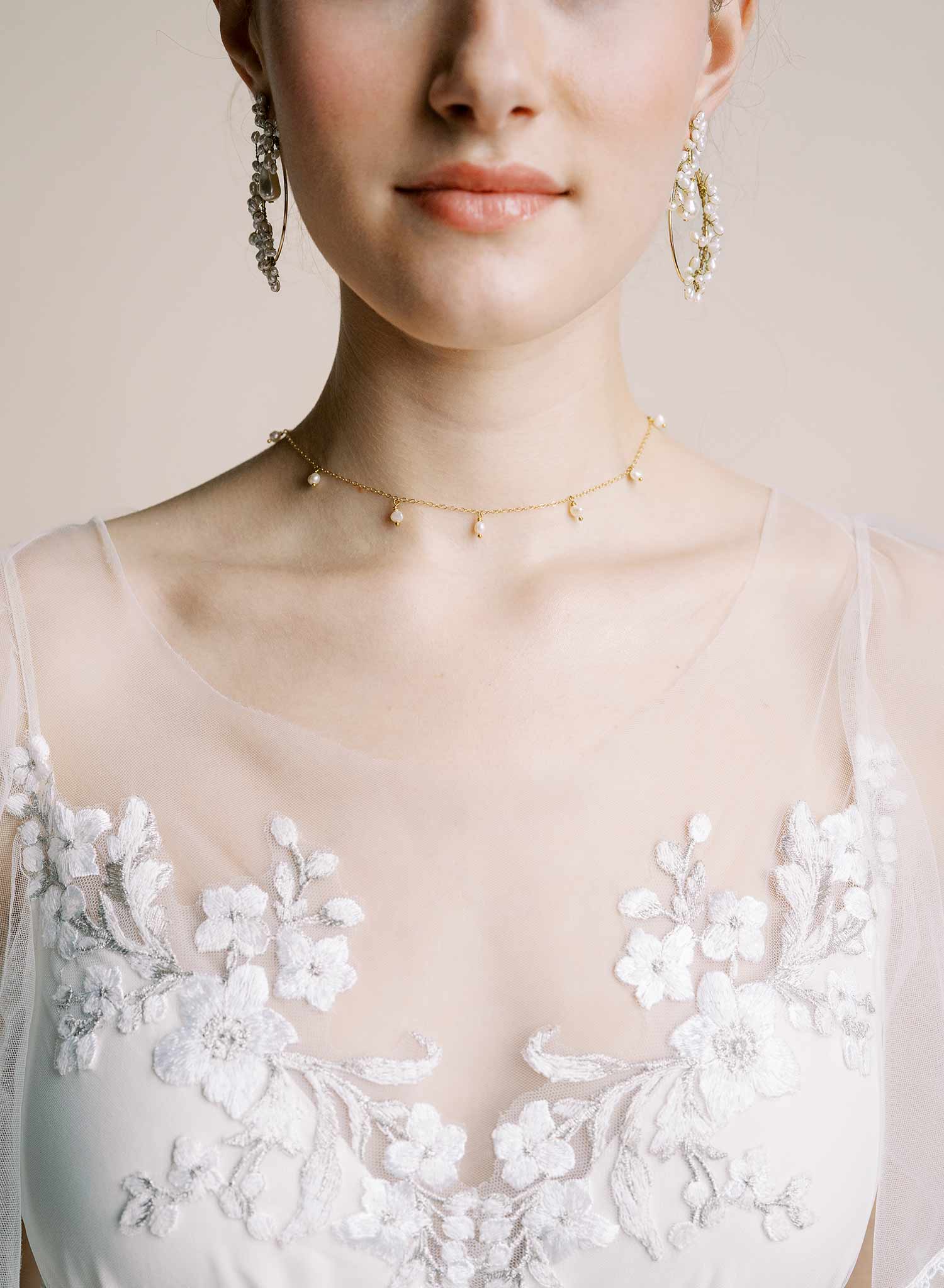 Delicate bridal gold chain necklace with freshwater pearls and floral petals by Twigs & Honey