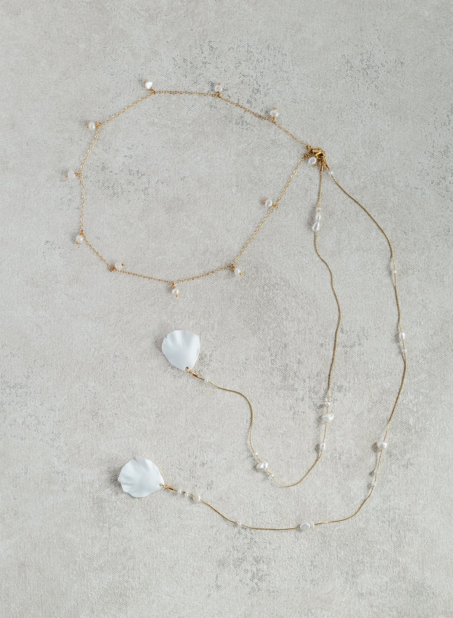 Delicate bridal gold chain necklace with freshwater pearls and floral petals by Twigs & Honey