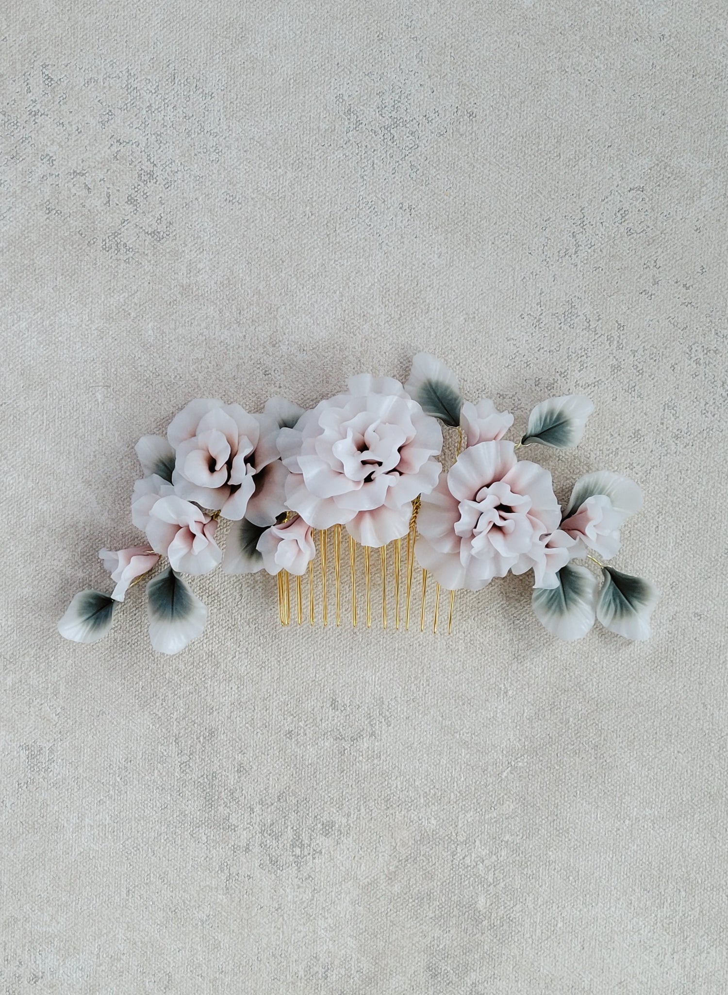 Handmade bridal comb with hand sculpted clay flowers. Wedding hair accessory.