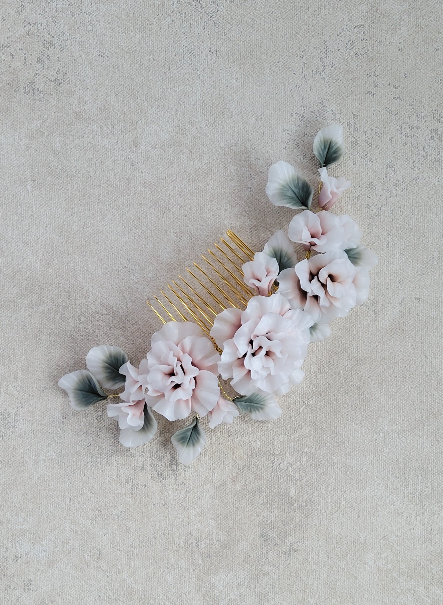 Handmade bridal comb with hand sculpted clay flowers. Wedding hair accessory.