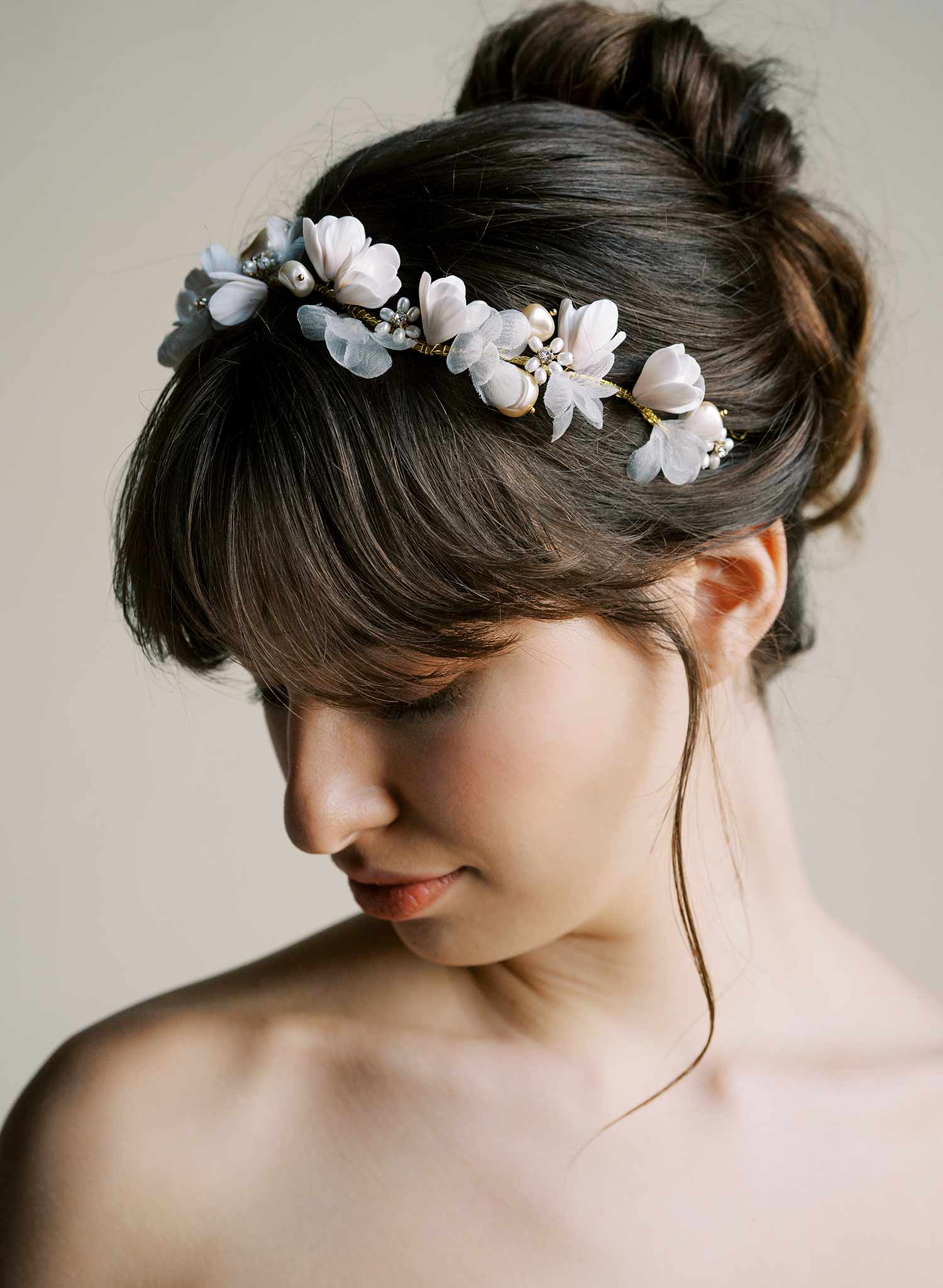 Bridal hair vine with hand sculpted clay magnolia flowers and silk petals by Twigs and Honey