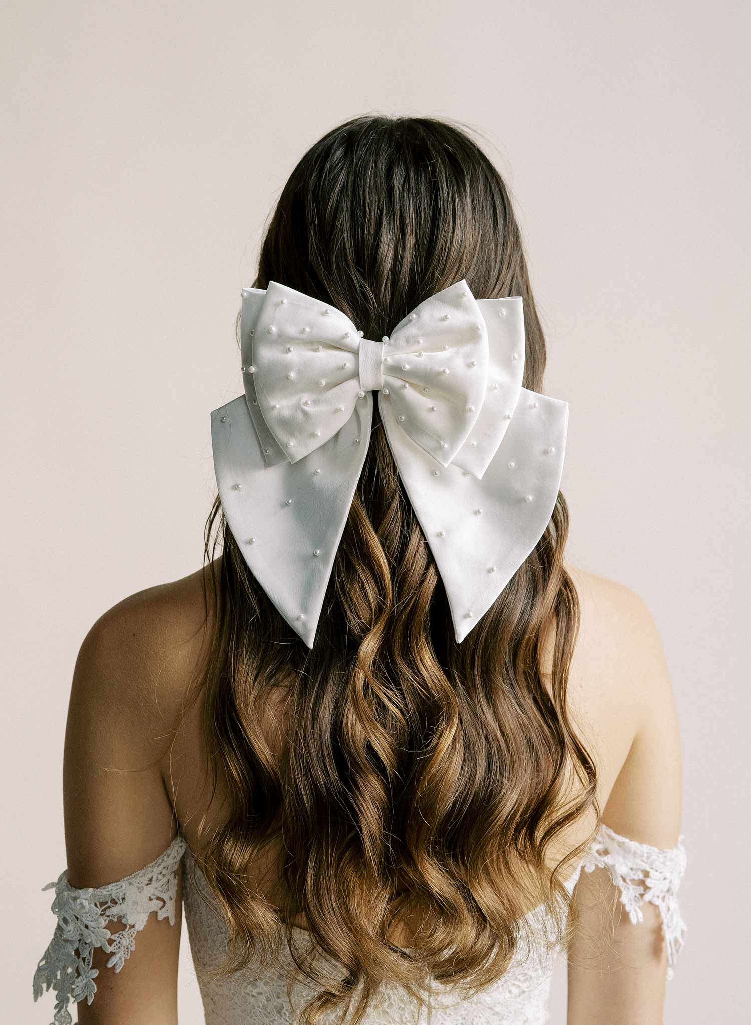 Handmade bridal hair bow with pearl beads by Twigs and Honey.