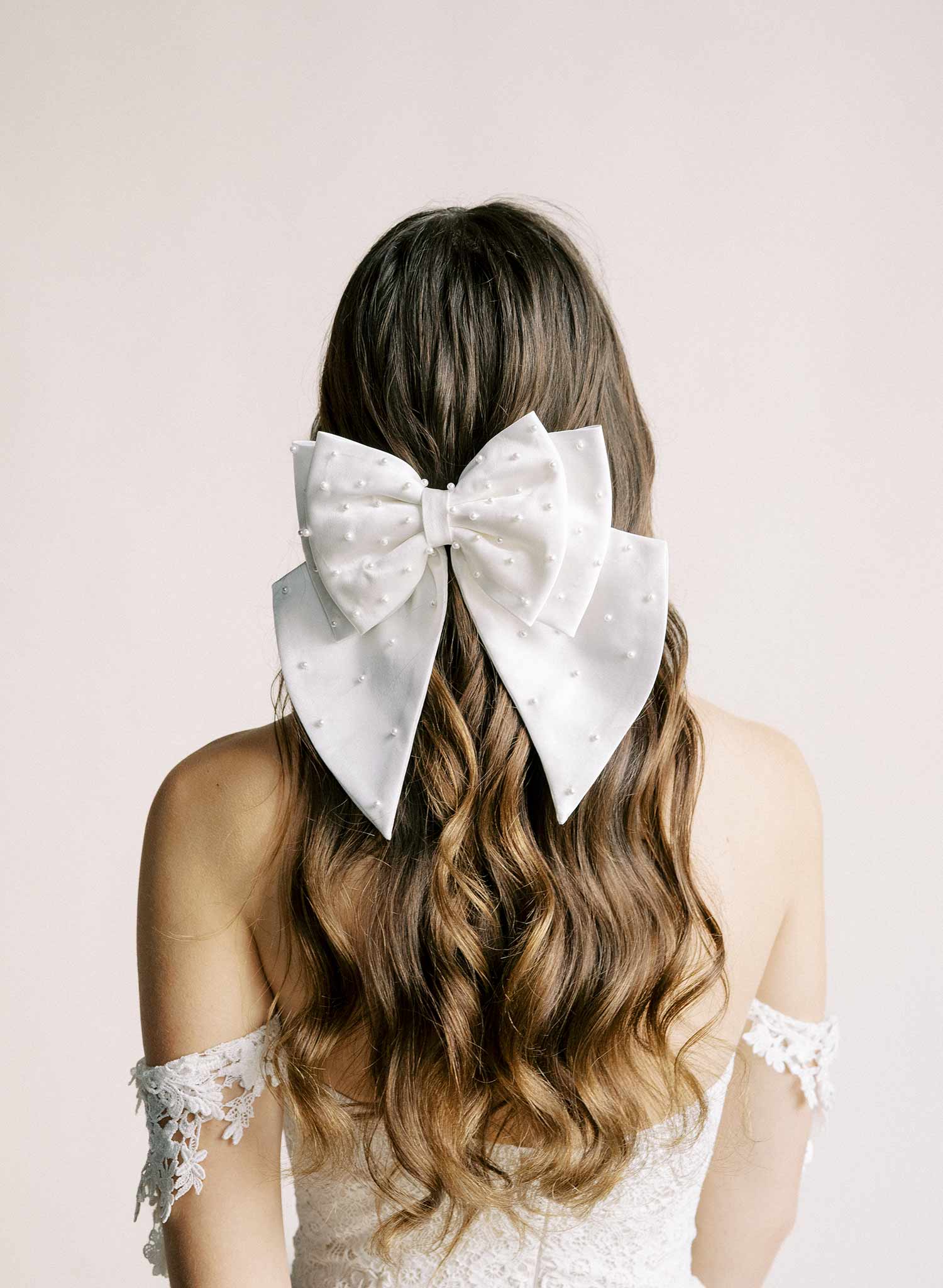 Handmade bridal hair bow with pearl beads by Twigs and Honey.