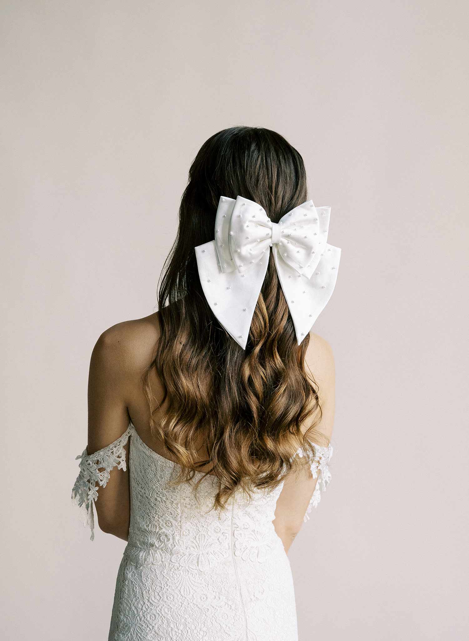 Handmade bridal hair bow with pearl beads by Twigs and Honey.