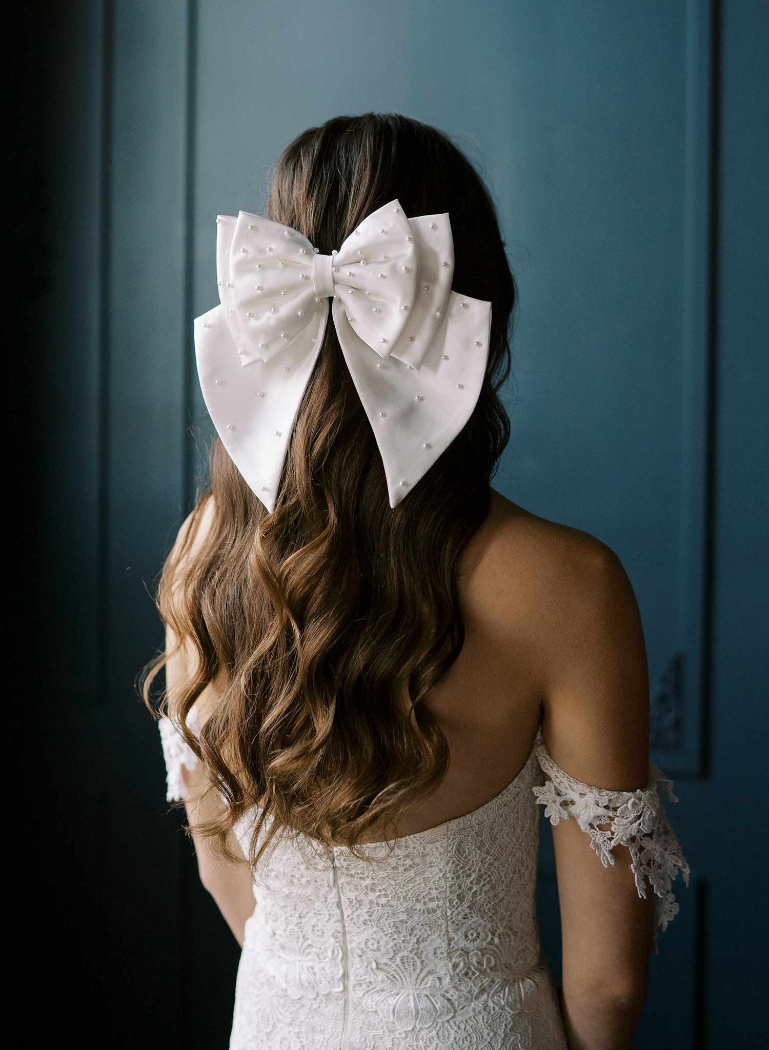 Handmade bridal hair bow with pearl beads by Twigs and Honey.