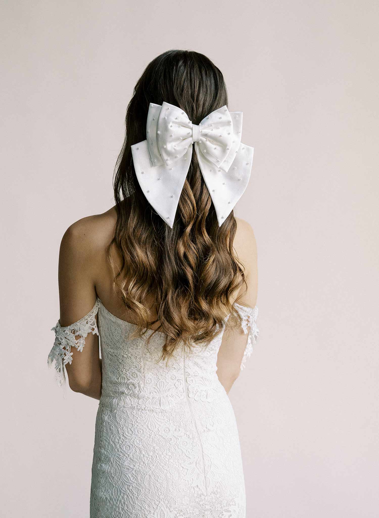 Handmade bridal hair bow with pearl beads by Twigs and Honey.