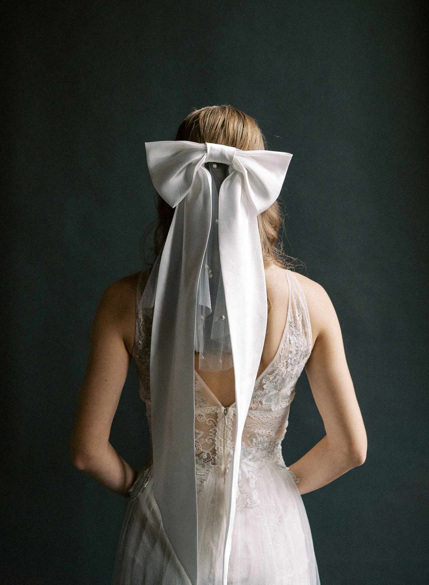 Handmade silk bow with long tails. Bridal bow with attached pearl mini veil.