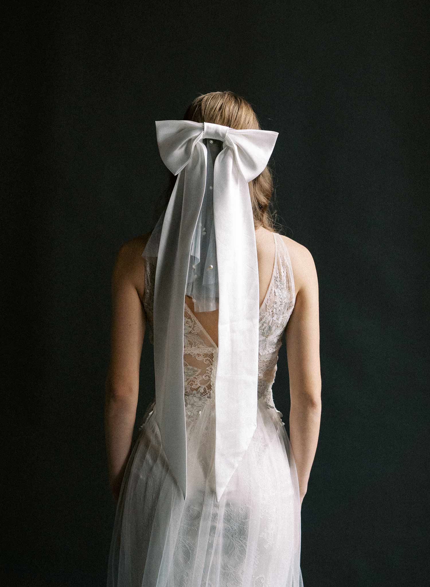 Handmade silk bow with long tails. Bridal bow with attached pearl mini veil.